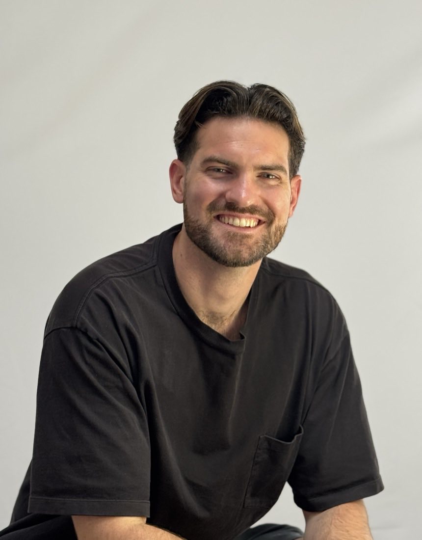 Brushback haircut with short sides and beard work at Dino's Barbershop, San Diego